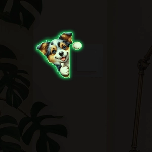 Luminous cute puppy wall sticker glowing in dark near light switch with green neon light