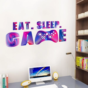 Dettaglio dell'adesivo da parete Eat Sleep Game con lettere 3D e icona controller