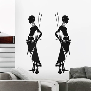 Detail of African tribal silhouettes wall decal set showing ethnic spear decoration on a white wall