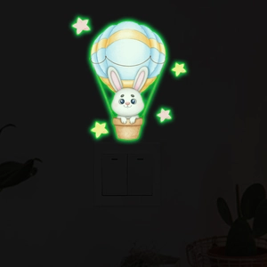 Sticker mural phosphorescent avec un lapin mignon en montgolfière et des étoiles