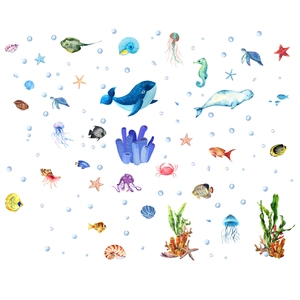 Luminous blue ocean life wall decals featuring whales, turtles, and colorful sea creatures