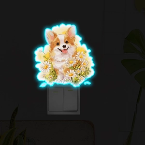 Autocollant néon bleu de chiot corgi et marguerites brillant sur un interrupteur