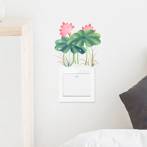 Watercolor green lotus and pink flower wall stickers decorating a white light switch