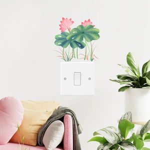 Pink lotus and green leaf wall sticker for home decor above a light switch