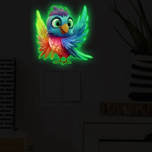 Luminous cartoon bird wall stickers glowing in dark green above a light switch