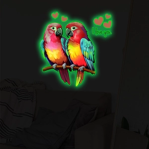 Luminous wall sticker showing glowing parrots on a branch with I love you text