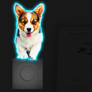 Macro view of Corgi wall light decoration with blue neon glowing frame on socket