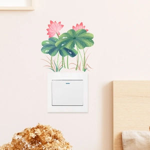 Detail showing pink lotus and green leaf wall stickers applied above a light switch