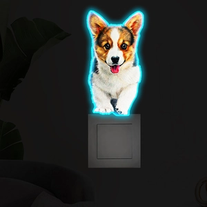 Detail of Corgi puppy wall socket night light with blue LED neon glowing edges