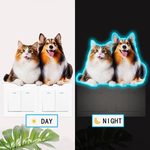 Glow-in-the-dark wall sticker featuring a cute cat and dog for light switch decoration