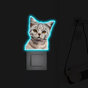 Close-up of a cat-shaped luminous wall sticker with blue neon light effect for home decor