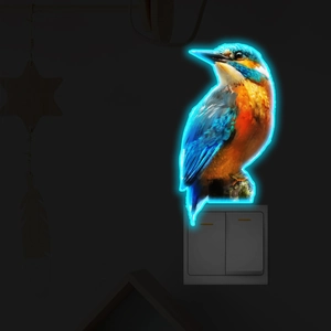 Luminous kingfisher bird wall sticker with neon blue glowing edges above a light switch