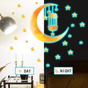 Luminous blue moon and stars wall stickers showing day and night glowing effect