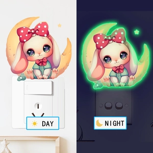 Glow-in-the-dark rabbit wall sticker showing day and night visual contrast effects