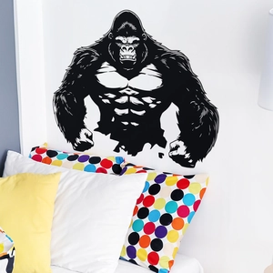 Modern black gorilla wall decal art for minimalist bedroom decor on smooth white surface