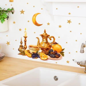 Detail of Ramadan wall stickers featuring golden coffee pot, moon and fruit on kitchen wall