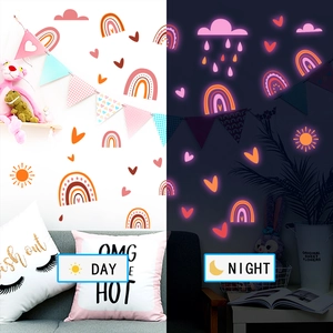 Luminous rainbow wall stickers showing glowing pink clouds and moon effects at night