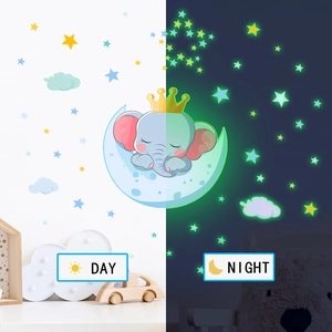 Glow in the dark elephant and moon wall stickers showing day and night contrast effect