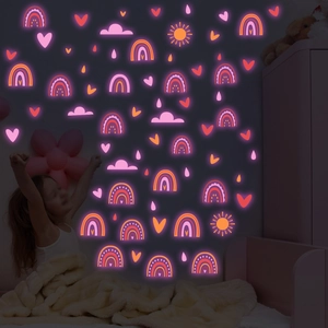Glow in the dark wall stickers featuring pink rainbow and moon for kids room decor