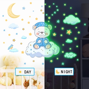 Glow in the dark moon and bear wall stickers showing day and night effect in nursery