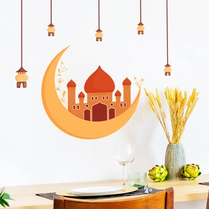 Detail of Ramadan moon and mosque wall stickers in a cozy warm dining room setting