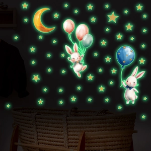 Glow in the dark bunny and balloon wall stickers creating a starry night in a kids room