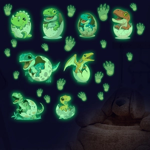 Luminous cartoon dinosaur wall stickers glowing in the dark for a cozy kid's bedroom décor