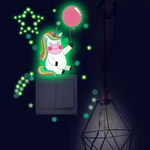 Luminous unicorn wall sticker with stars glowing in dark green around light switch