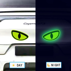 Detailed comparison of glowing green cat eye vinyl stickers showing day and night effects