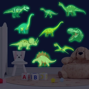 Stickers muraux dinosaures fluorescents montrant des motifs T-Rex brillants dans le noir