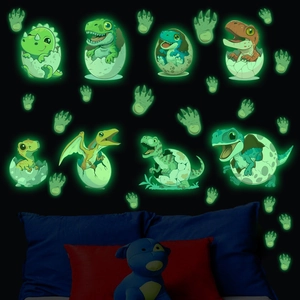 Glow-in-the-dark cartoon dinosaur egg wall stickers showing neon green luminous effect