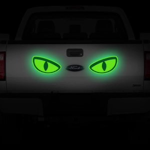 Macro detail of honeycomb reflective cat eye vinyl decals glowing on vehicle surface