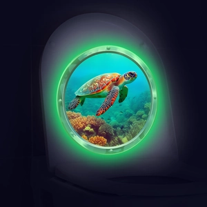 Close-up of 3D sea turtle toilet sticker with green neon glowing underwater porthole effect