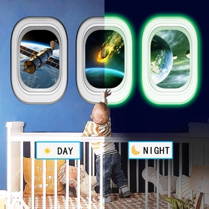 Luminous aircraft window wall decals showing space views in day and night glowing mode