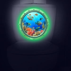 Luminous round ocean world wall sticker with tropical fish and coral glowing in the dark