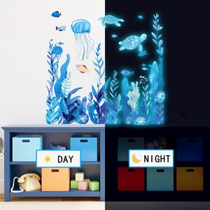 Luminous blue ocean wall stickers showing day and night comparison with sea turtle and jellyfish