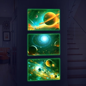 Macro detail of three luminous space planet wall decals with glowing green galaxy effects