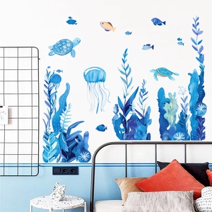 Luminous blue marine wall stickers featuring turtles, jellyfish and seaweed in a bedroom