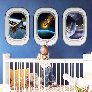 Set of three glowing space wall stickers featuring airplane windows with Earth and satellites