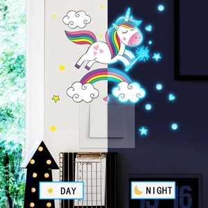 Day and night comparison of unicorn and rainbow glow in the dark wall stickers for nursery