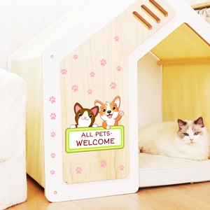 Cute white and wood cat house with cartoon puppies and All Pets Welcome sign indoors
