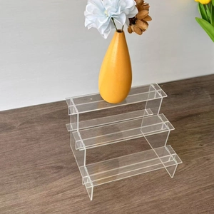 Macro detail of high-quality 3-tier clear acrylic tiered display stand structure