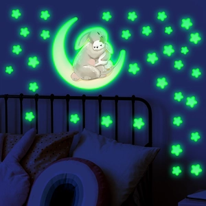 Luminous wall sticker set featuring rabbits on a moon with glowing stars for bedroom decor