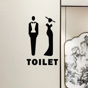 Modern black vinyl toilet wall decals featuring elegant suit and dress silhouette signs