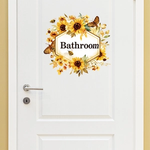 Self-adhesive sunflower and butterfly wall stickers with Bathroom text on a white door