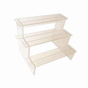 Three-tier clear acrylic display riser stand for collectible figures and cosmetics