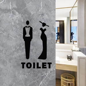 Detail of creative black vinyl toilet wall sticker with male and female silhouettes