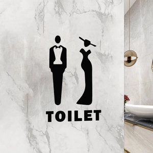 Detail of elegant black vinyl toilet wall sticker with man and woman silhouettes and TOILET text
