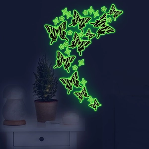 Luminous butterfly and star wall stickers in green glow for home decor on dark walls