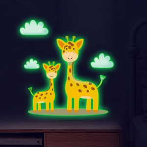 Luminous green cartoon giraffe and clouds wall stickers glowing in a dark room setting